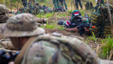 U.S. Army Soldiers assigned to the 11th Airborne Division, 1st Brigade Combat Team, Fort Wainwright, Alaska, and Indonesian soldiers assigned to the Indonesian Army Strategic Reserve Command, hold a secure position at the Jungle Field Training Exercise during Super Garuda Shield 25 in Baturaja, Indonesia, Aug. 29, 2025. Super Garuda Shield is an annual exercise between the Indonesian National Armed Forces and the U.S. military designed to strengthen bilateral interoperability, capabilities and cooperation. (U.S. Army photo by Spc. John Farmer)