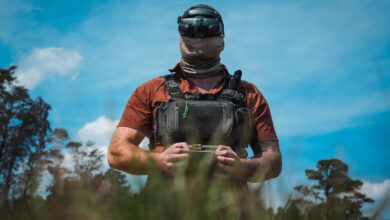 An Unmanned Aerial Vehicle (UAV) drone operator assigned to 1st Special Forces Command (Airborne) pilots a UAV at a counter-drone range in Ellerbe, North Carolina, May 5, 2026. UAV flight equipment consists of a drone, a radio controller, a wireless transceiver, and First Person View (FPV) goggles. This photo has been altered to protect the identity of the operator. (U.S. Army photo by Ssg. Gabriel E. Davis)