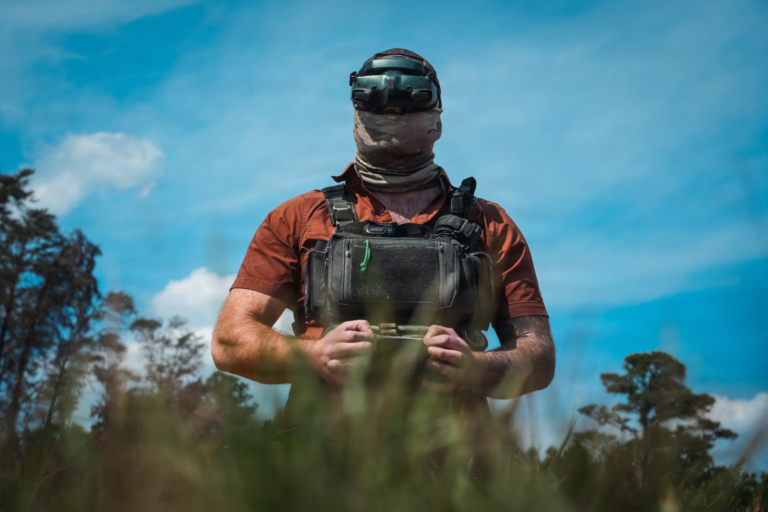An Unmanned Aerial Vehicle (UAV) drone operator assigned to 1st Special Forces Command (Airborne) pilots a UAV at a counter-drone range in Ellerbe, North Carolina, May 5, 2026. UAV flight equipment consists of a drone, a radio controller, a wireless transceiver, and First Person View (FPV) goggles. This photo has been altered to protect the identity of the operator. (U.S. Army photo by Ssg. Gabriel E. Davis)