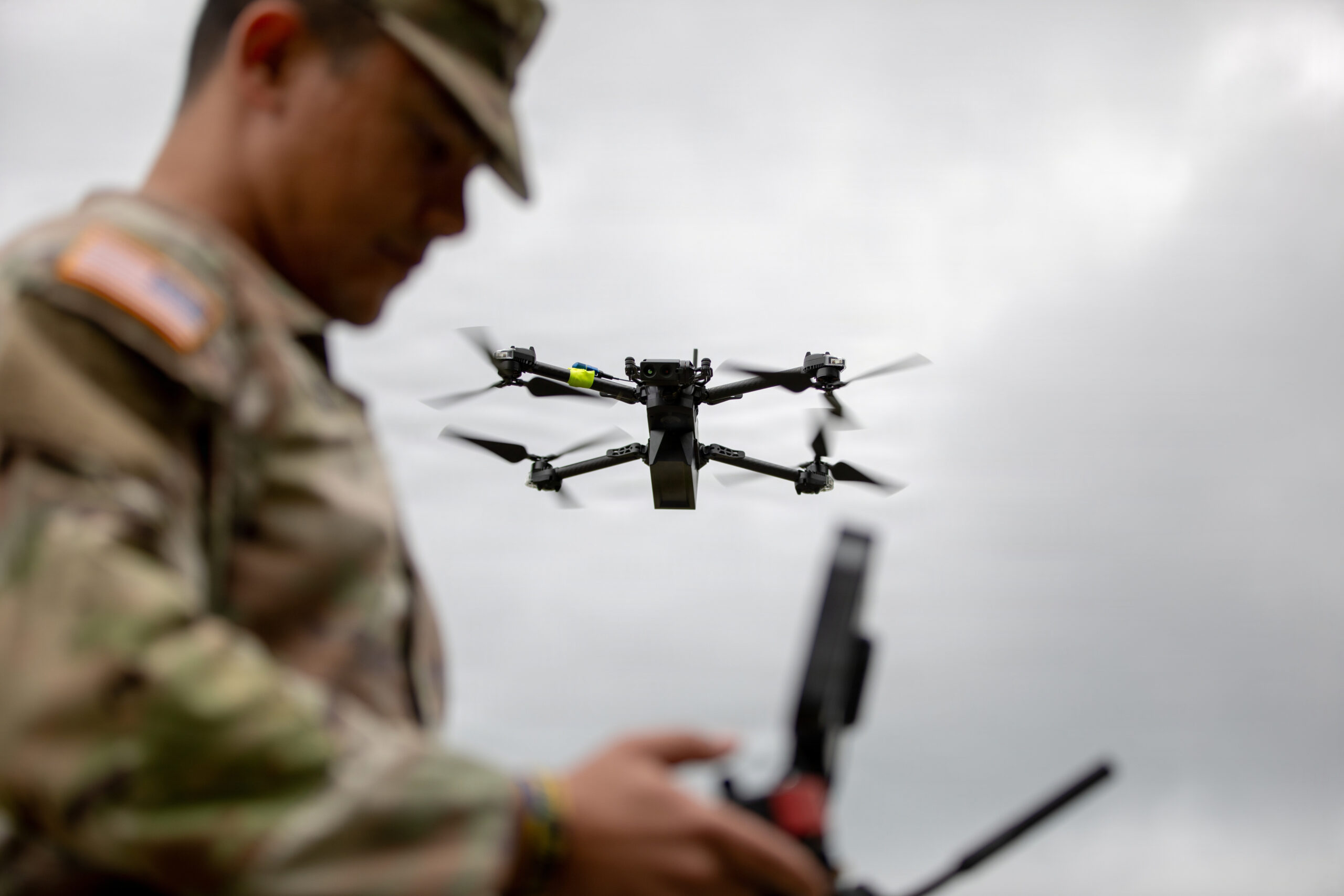 Tennessee Army National Guard Warrant Officer 1 Cedrick Pierson, a 948B Electronic Systems Maintenance Warrant Officer assigned to the 777th Maintenance Company, pilots a Skydio RQ-28A drone during a Small Unmanned Aircraft Systems (SUAS) Master Trainer Course in Tullahoma, Tennessee, June 23, 2026. Pierson attended the course to better understand how unmanned aircraft systems can support future sustainment operations and maintenance formations. Among the first courses of its kind in the Army National Guard, the SUAS Master Trainer Course prepares Soldiers to employ drone capabilities in support of reconnaissance, terrain analysis, and mission planning. (U.S. Army National Guard photo by 1st Lt. Bailey Breving)