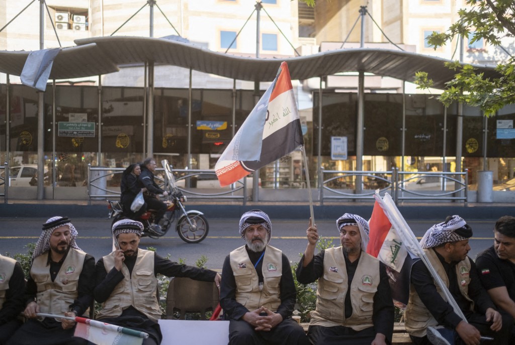 Members of Iraq's Popular Mobilization Forces (PMF) take part in an anti-US and anti-Israeli gathering outside the Iraqi Embassy in Tehran, Iran, on April 23, 2026. Photo: Morteza Nikoubazl/NurPhoto via AFP