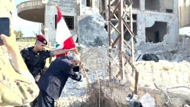 Images distrubted by national broadcaster Tele Liban show Lebanese Prime Minister Nawaf Salam planting a flag in the village of Zawtar al-Gharbiya, one of three "pilot zones" where the Lebanese army has deployed as part of a US-backed deal with Israel to disarm Hezbollah