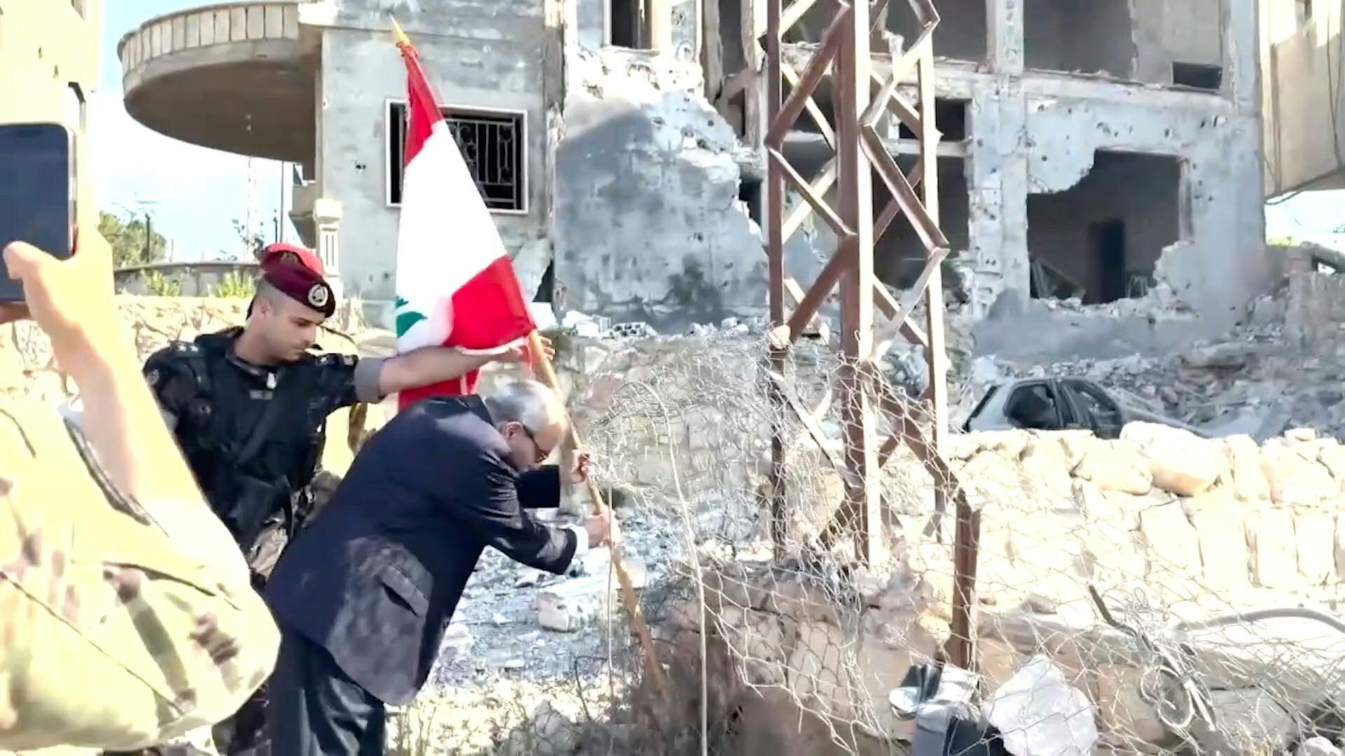 Images distrubted by national broadcaster Tele Liban show Lebanese Prime Minister Nawaf Salam planting a flag in the village of Zawtar al-Gharbiya, one of three "pilot zones" where the Lebanese army has deployed as part of a US-backed deal with Israel to disarm Hezbollah