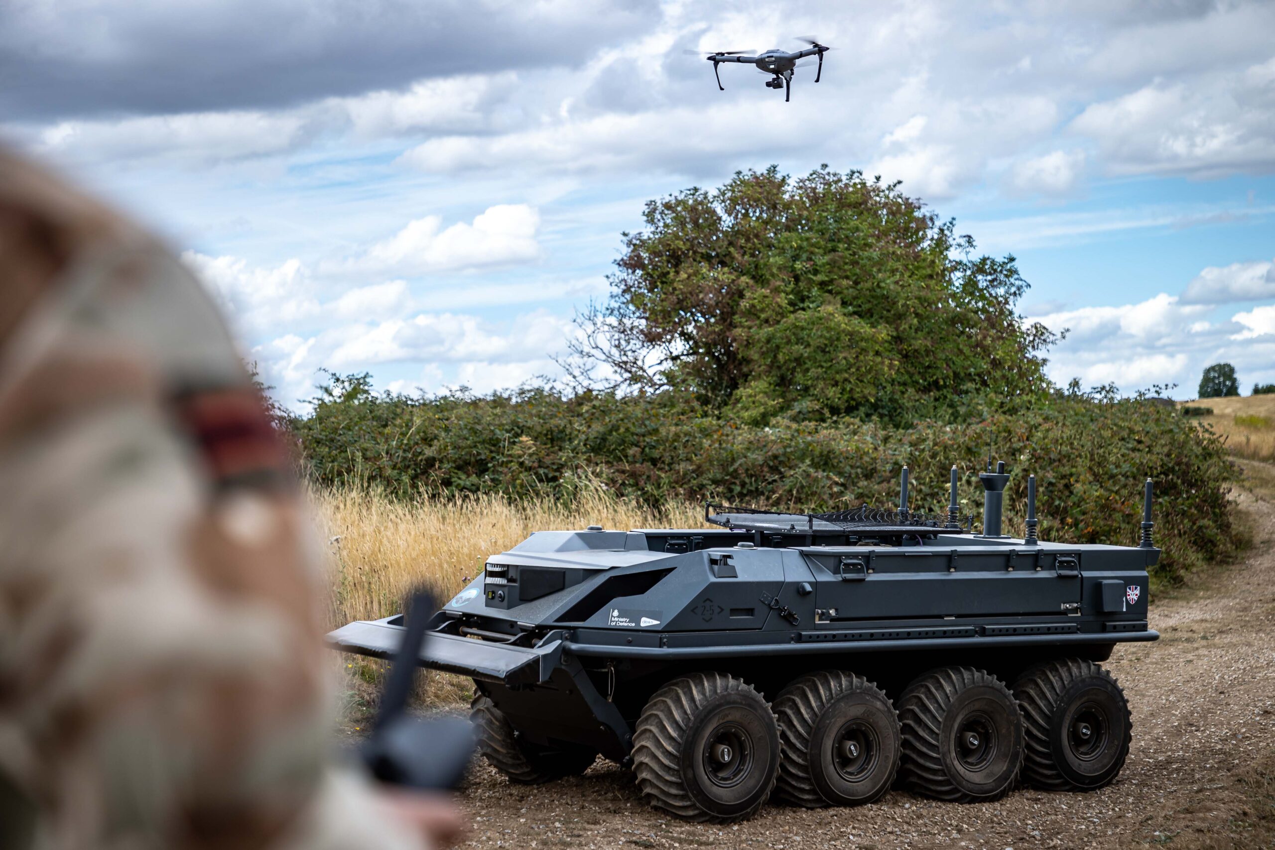Lance Corporal Kai Webb, from ITDU (Infantry Trials and Development Unit) operates the AtlasPro drone using the AtlasStation touchscreen tablet during a demonstration to showcase the capability of autonomous drones and Robotic Platoon Vehicles (RPVs) on Salisbury Plain Training Area. The MoDs Future Capability Group (FCG) have been demonstrating operating swarming UAS systems. It is the first time a military operator has flown a swarming system which is a significant achievement for the future capability group and the Army. A swarm is comprised of one operator controlling 4-6 UAS which demonstrates a real step forward in technology and reduction of manpower. Instead of having one operator per drone you now require less operators who can control many drones.