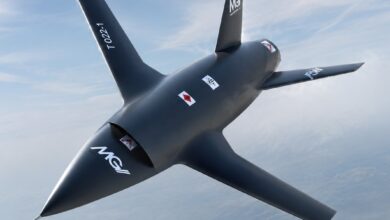 The MGI Engineering T-022 Vortex autonomous collaborative combat aircraft flying against a high-altitude blue sky, designed for UK manned-unmanned teaming operations.