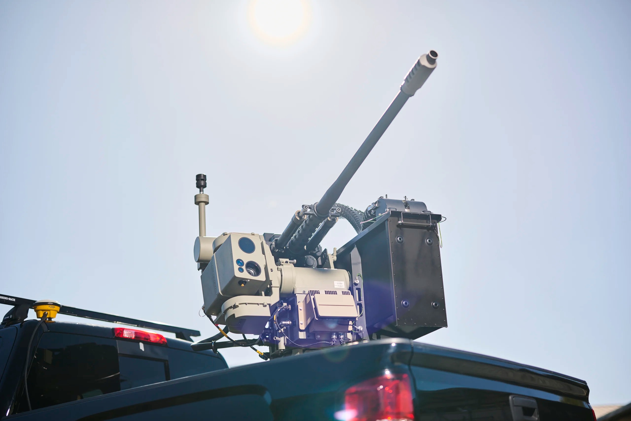 An Electro Optic Systems (EOS) Slinger remote weapon station mounted on a pickup truck, acting as a representative image for Australia's new R400 Slinger counter-drone system contract.