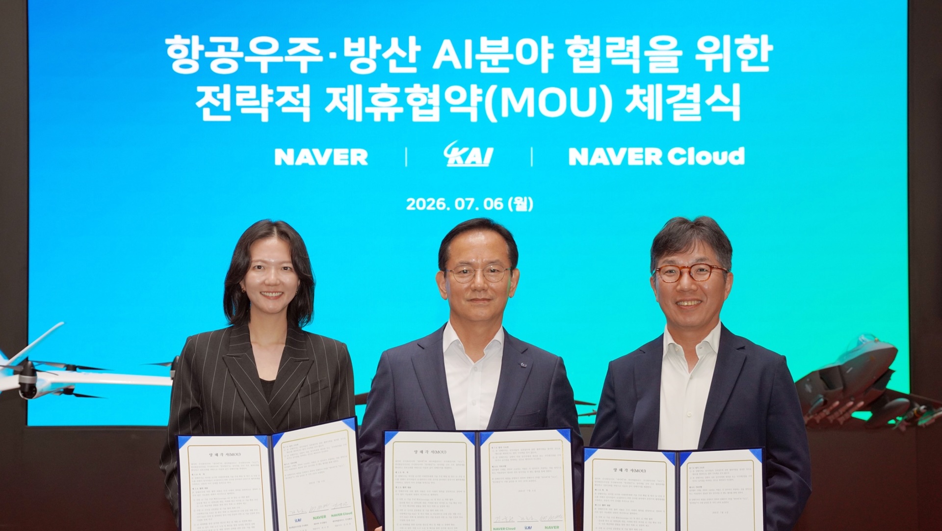 Naver CEO Choi Soo-yeon (left), Korea Aerospace Industries President and CEO Kim Jong-chul (center), and Naver Cloud CEO Kim Yu-won sign a strategic agreement to collaborate on sovereign AI technologies for South Korea’s aerospace and defense sectors. Photo: Naver