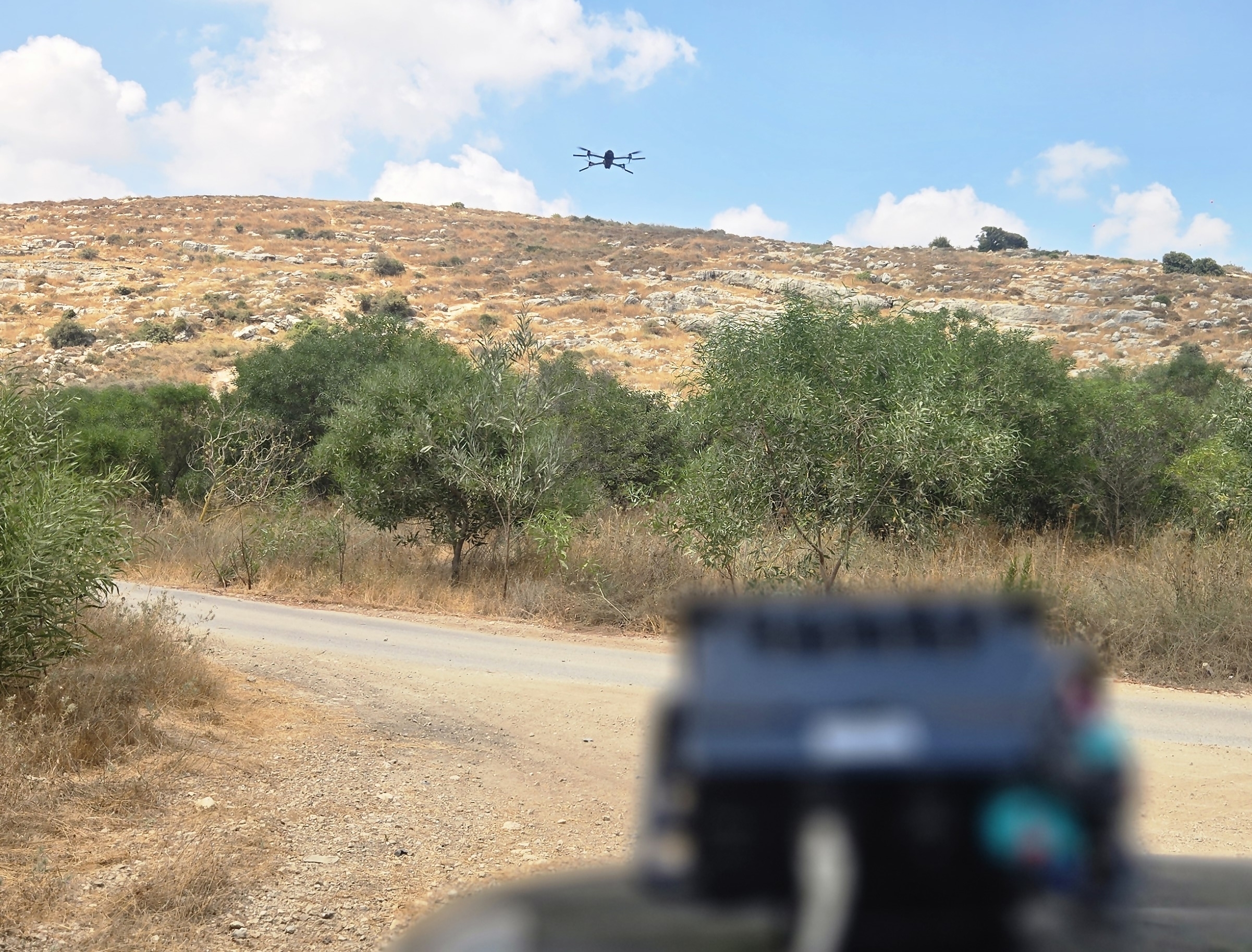 A LiDAR device aimed at an unmanned aerial system