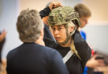 A new conscript in the Air Force tries on the size of the helmet.